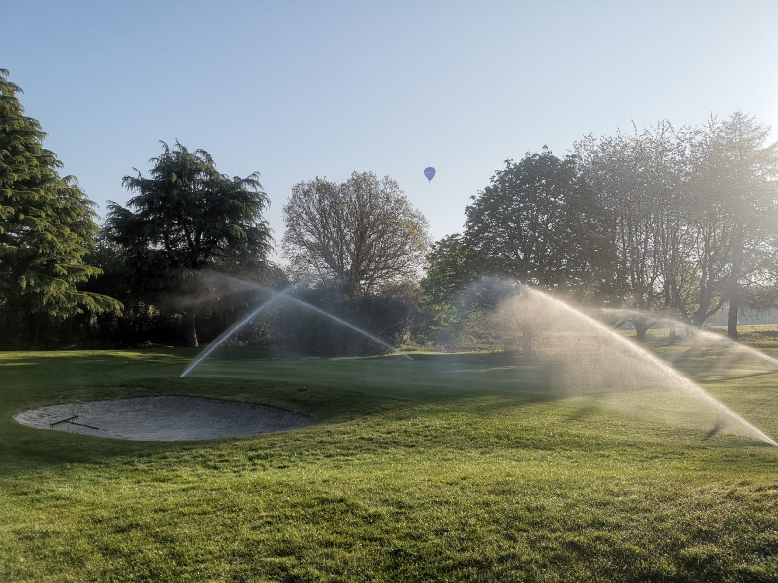 View of Irrigation system sprinklers for golf course